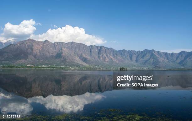 Reflection of Zabarwan hill over one of the prominent lake in Dal lake in Srinagar, the summer capital of Indian administered Kashmir. Zabarwan...