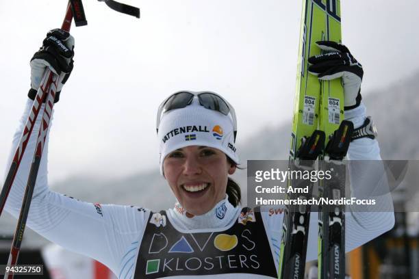 Charlotte Kalla of Sweden celebrates her second place at the Women's 10 km Individual event in the FIS Cross Country World Cup on December 13, 2009...