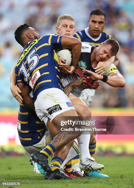 Trent Merrin of the Panthers is tackled by the Eels defence during the round five NRL match between the Parramatta Eels and the Penrith Panthers at...