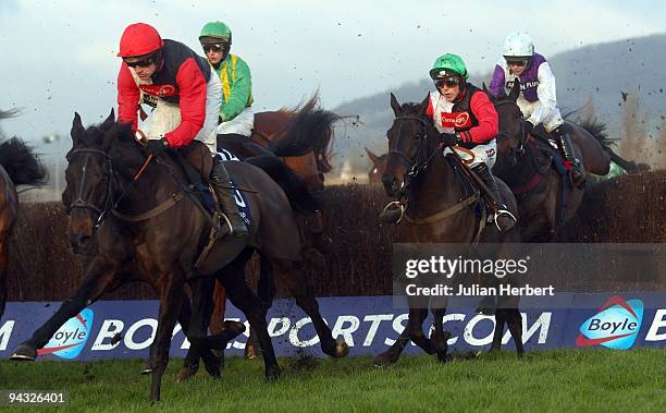 Ruby Walsh and Poquelin lead the field from an early fence before going on to land The boylesports.com Gold Cup Race run at Cheltenham Racecourse on...
