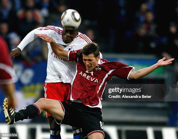 Guy Demel of Hamburg fights for the ball with Christian Eigler of Nuernberg during the Bundesliga match between 1. FC Nuernberg and Hamburger SV at...