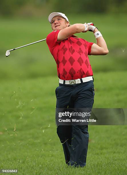 Pelle Edberg of Sweden plays his second shot out of the rough on the 18th hole during the third round of the Alfred Dunhill Championship at Leopard...