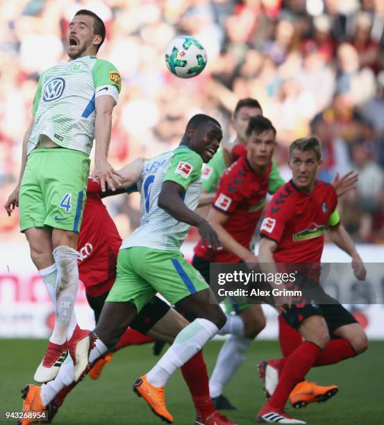 Ignacio Camacho of Wolfsburg jumps for the ball during the Bundesliga match between Sport-Club Freiburg and VfL Wolfsburg at Schwarzwald-Stadion on...