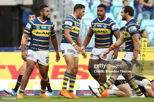 Michael Jennings of the Eels celebrates with team mates after scoring a try during the round five NRL match between the Parramatta Eels and the...