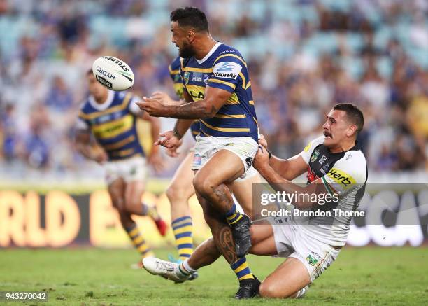 Ken Edwards of the Eels offloads the ball during the round five NRL match between the Parramatta Eels and the Penrith Panthers at ANZ Stadium on...