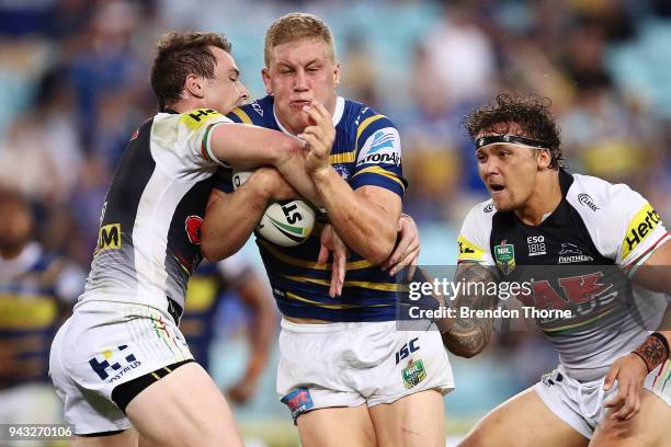 Daniel Alvaro of the Eels is tackled by the Panthers defence during the round five NRL match between the Parramatta Eels and the Penrith Panthers at...