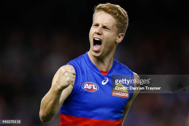 Lachie Hunter of the Bulldogs celebrates a goal during the round three AFL match between the Western Bulldogs and the Essendon Bombers at Etihad...