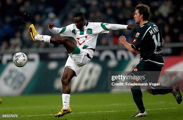 Didier Ya Konan of Hannover in action with Thorben Marx of Moenchengladbach during the Bundesliga match between Borussia Moenchengladbach and...