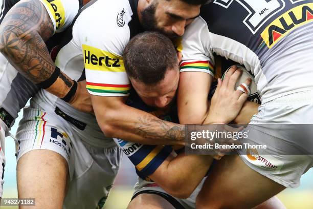 Nathan Brown of the Eels is tackled by the Panthers defence during the round five NRL match between the Parramatta Eels and the Penrith Panthers at...