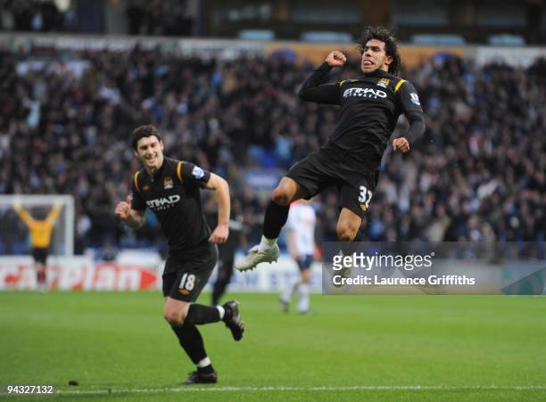 Carlos Tevez of Manchester City jumps for joy as he celebrates scoring the equalising goal during the Barclays Premier League match between Bolton...