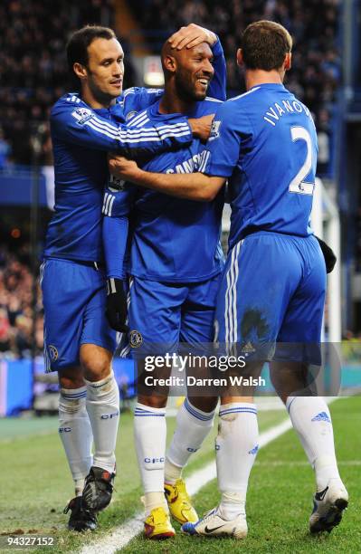 Nicolas Anelka of Chelsea celebrates with team mates Ricardo Carvalho and Branislav Ivanovic after scoring his sides second goal during the Barclays...