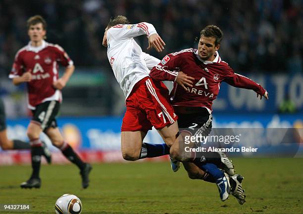 Dennis Diekmeier of Nuernberg tackles Marcell Jansen of Hamburg during the Bundesliga match between 1. FC Nuernberg and Hamburger SV at Easy Credit...