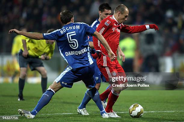 Arjen Robben of Bayern battles for the ball with Marc Pfertzel and Christoph Dabrowski of Bochum during the Bundesliga match between VfL Bochum and...