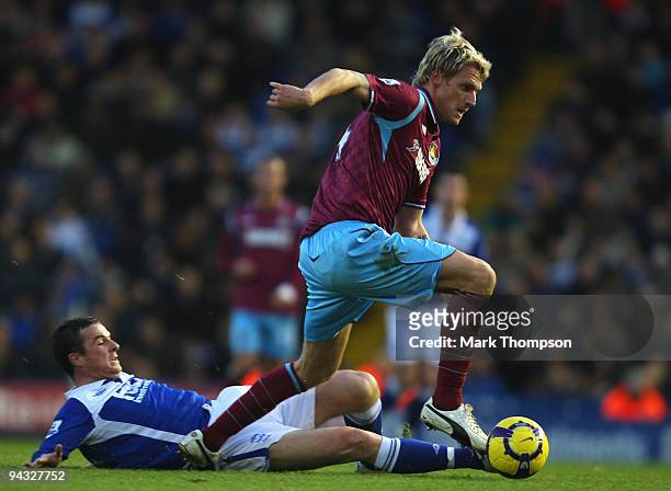 Barry Ferguson of Birmingham City tangles with Radoslav Kovac of West Ham United during the Barclays Premier League match between Birmingham City and...