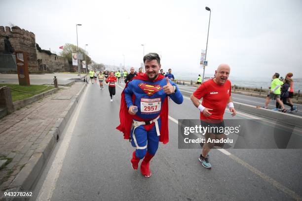 Man wears a Superman costume as he takes part in the 13th Vodafone Istanbul Half Marathon, started from the Yenikapi Square, in Istanbul, Turkey on...