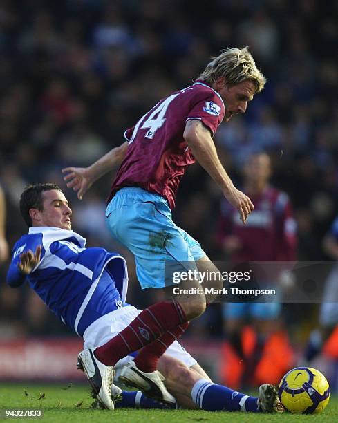 Barry Ferguson of Birmingham City tangles with Radoslav Kovac of West Ham United during the Barclays Premier League match between Birmingham City and...