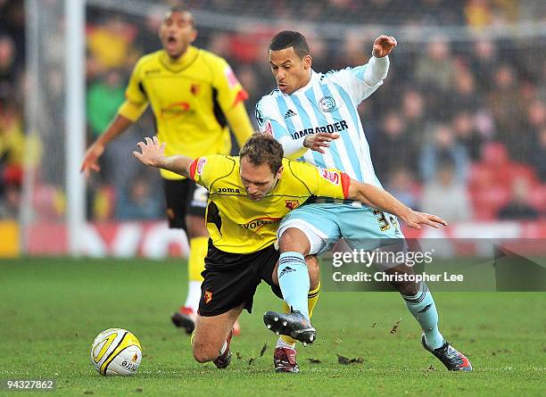 John Eustace of Watford battles with DJ Campbell of Derby during the Coca-Cola Championship match between Watford and Derby County at Vicarage Road...