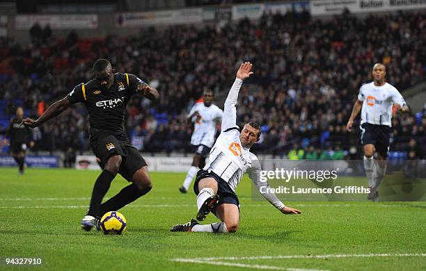 Micah Richards of Manchester City fires home the second goal during the Barclays Premier League match between Bolton Wanderers and Manchester City at...