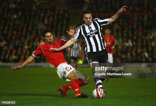 Anderson De Silva of Barnsley tackles Jose Enrique of Newcastle in action during the Coca-Cola Championship match between Barnsley and Newcastle...