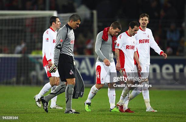 Koeln players leave the pitch after the Bundesliga match between SC Freiburg and 1. FC Koeln at Badenova Stadium on December 12, 2009 in Freiburg im...