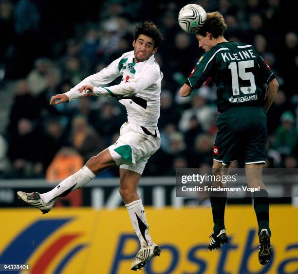 Karim Haggui of Hannover in action with Thomas Kleine of Moenchengladbach during the Bundesliga match between Borussia Moenchengladbach and Hannover...