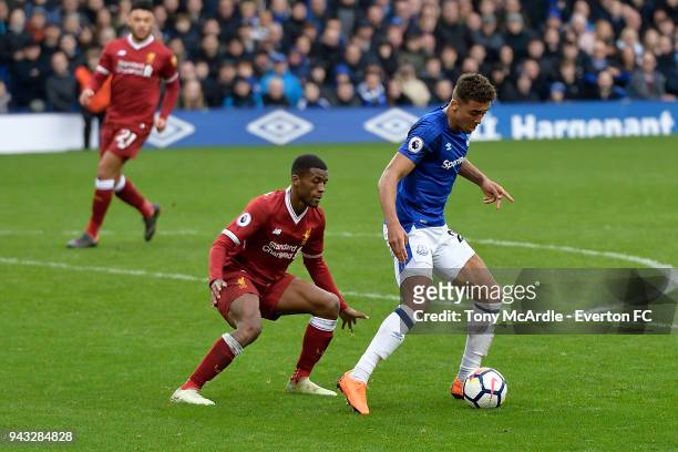 Dominic Calvert-Lewin of Everton shields the ball from Georginio Wijnaldum of Liverpool challenge for the ball during the Premier League match...