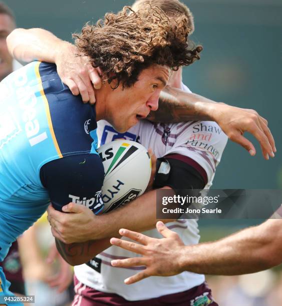 Kevin Proctor of the Titans tries to break through a tackle during the round five NRL match between the Gold Coast Titans and the Manly Sea Eagles at...