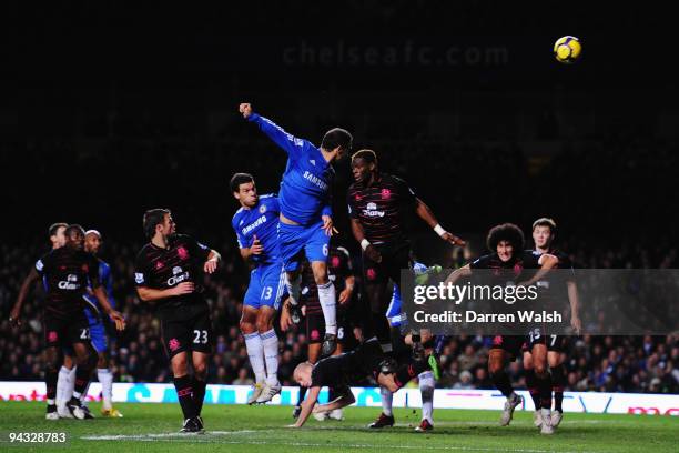 Ricardo Carvalho of Chelsea rises above the Everton defence to head the ball during the Barclays Premier League match between Chelsea and Everton at...