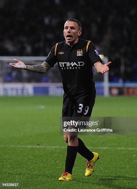 Craig Bellamy of Manchester City reacts after being sent off by referee Mark Clattenburg during the Barclays Premier League match between Bolton...