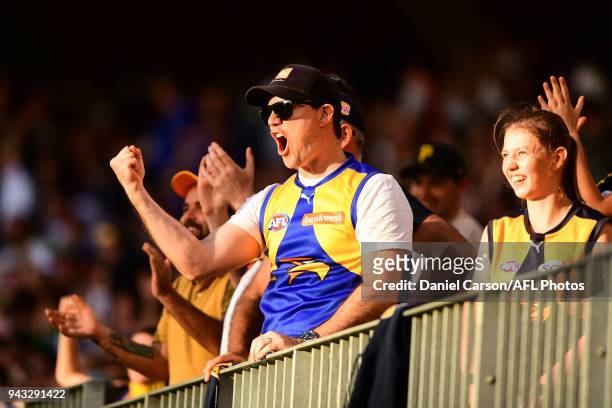 Eagles fans celebrate a goal during the 2018 AFL round 03 match between the West Coast Eagles and the Geelong Cats at Perth Stadium on April 8, 2018...