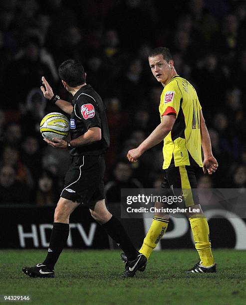 Referee Keith Stroud asks Heider Helguson of Watford to leave the field after he clashes heads in a tackle during the Coca-Cola Championship match...