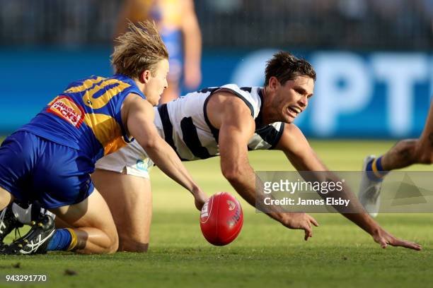 Jackson Nelson of the Eagles tackles Tom Hawkins of the Cats during the round three AFL match between the West Coast Eagles and the Geelong Cats at...