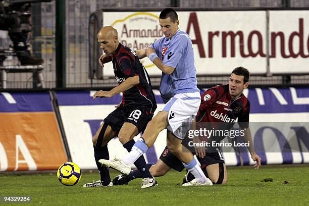 Andrea Parola and Andrea Lazzari of Cagliari compete for the ball with Hamsik Marek of Napoli during the Serie A match between Cagliari and Napoli at...