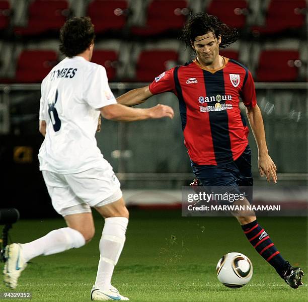 Argentinian Santiago Solari of Mexico's Atlante FC competes with Chad Coombes of New Zealand's Auckland City during their 2009 FIFA Club World Cup...