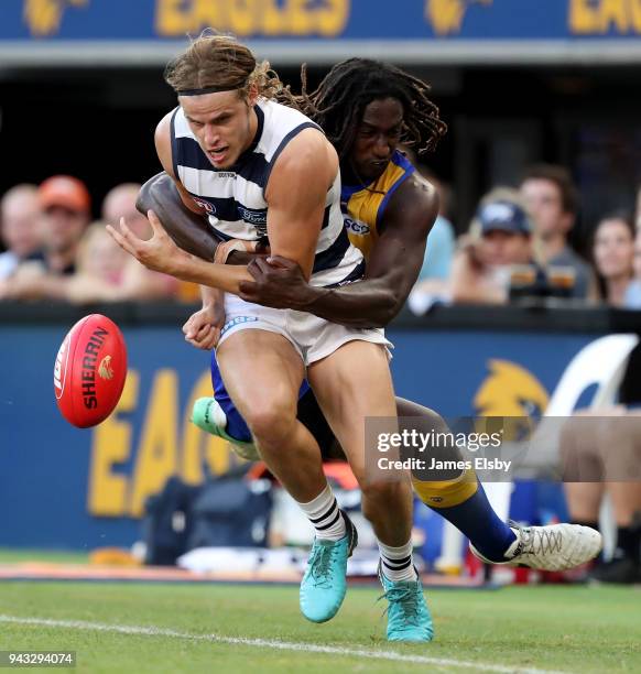 Nic Naitanui of the Eagles tackles Jake Kolodjashnij of the Cats during the round three AFL match between the West Coast Eagles and the Geelong Cats...