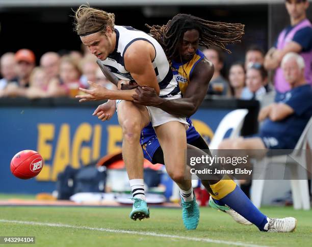 Nic Naitanui of the Eagles tackles Jake Kolodjashnij of the Cats during the round three AFL match between the West Coast Eagles and the Geelong Cats...