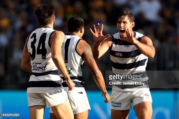 Tom Hawkins of the Cats celebrates a goal during the round three AFL match between the West Coast Eagles and the Geelong Cats at Optus Stadium on...