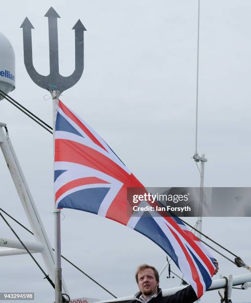 Fisherman attaches a Union Flag to his vessel as fishing boats gather on the River Tyne in North Shields as fishermen take part in a nationwide...
