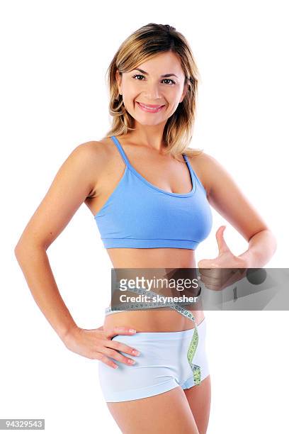 happy girl with measure tape around the waist. - smiling woman waist up stock pictures, royalty-free photos & images