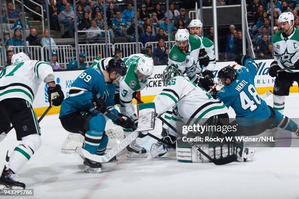 Mike McKenna and John Klingberg of the Dallas Stars defend the net against Logan Couture and Tomas Hertl of the San Jose Sharks at SAP Center on...