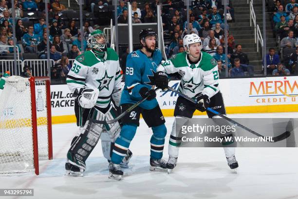 Mike McKenna and Ersa Lindell of the Dallas Stars defend the net against Melker Karlsson of the San Jose Sharks at SAP Center on April 3, 2018 in San...