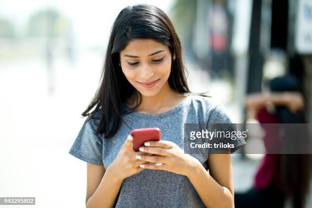 beautiful woman using mobile phone - girls stock pictures, royalty-free photos & images