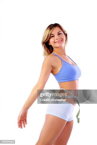 happy girl with measure tape around the waist. - woman waist up isolated stock pictures, royalty-free photos & images