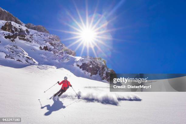 freerider skier running downhill - ochsenkar at mount hochkönig  in alps - high up stock pictures, royalty-free photos & images