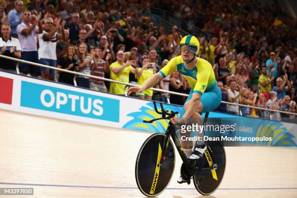 Matt Glaetzer of Australia celebrates a games record time after he competes and wins the Men's 1000m Time Trial track cycling on day four of the Gold...