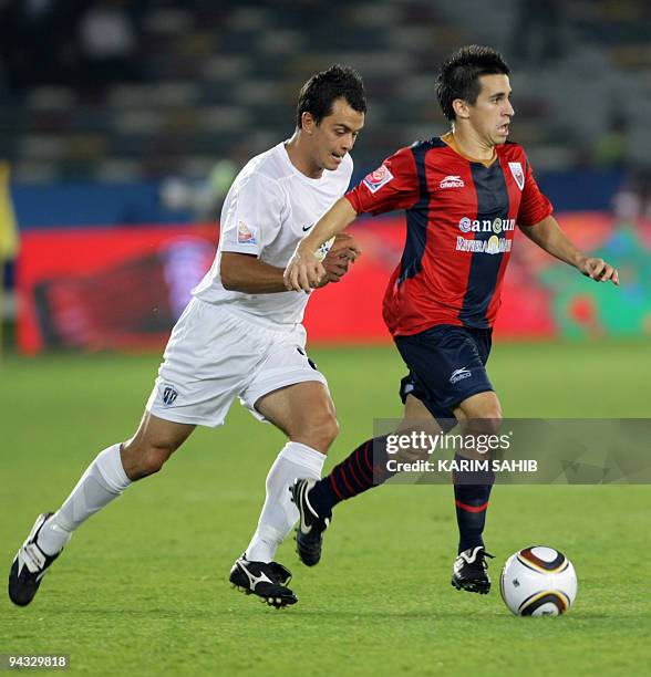 Fernando Navarro of Mexico's Atlante FC battles for the ball with Daniel Koprivic of New Zealand's Auckland City during their 2009 FIFA Club World...