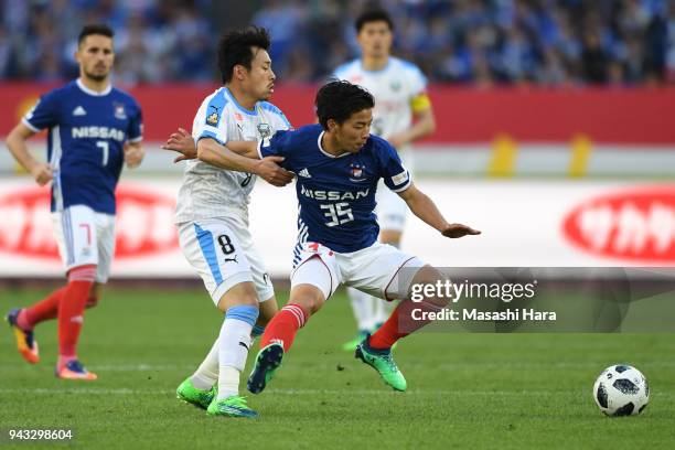 Kaina Yoshio of Yokohama F.Marinos and Hiroyuki Abe of Kawasaki Frontale compete for the ball during the J.League J1 match between Yokohama F.Marinos...