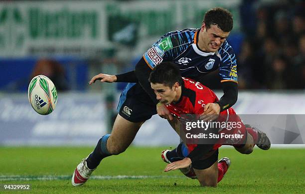 Blues centre Jamie Roberts tackles Toulouse scrum half Nicolas Bezy during the Heineken Cup Pool 5 match between Cardiff Blues and Toulouse at the...