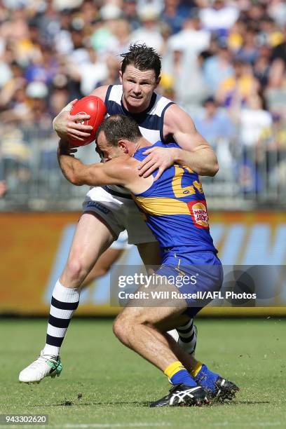 Patrick Dangerfield of the Cats is tackled by Shannon Hurn of the Eagles during the round three AFL match between the West Coast Eagles and the...