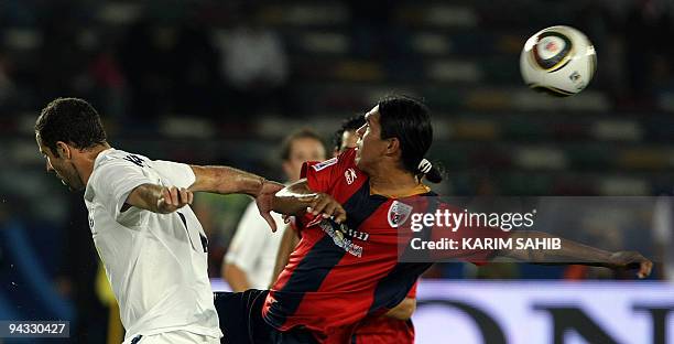 Luis Velasquez of Mexico's Atlante FC competes with Daniel Koprivic of New Zealand's Auckland City during their 2009 FIFA Club World Cup...